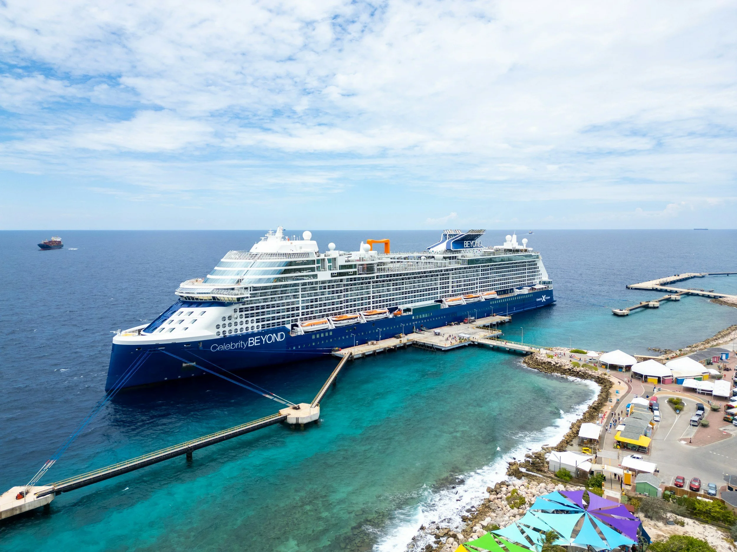 Celebrity Cruise ship in blue water, new promotion, perfect for summer vacation.