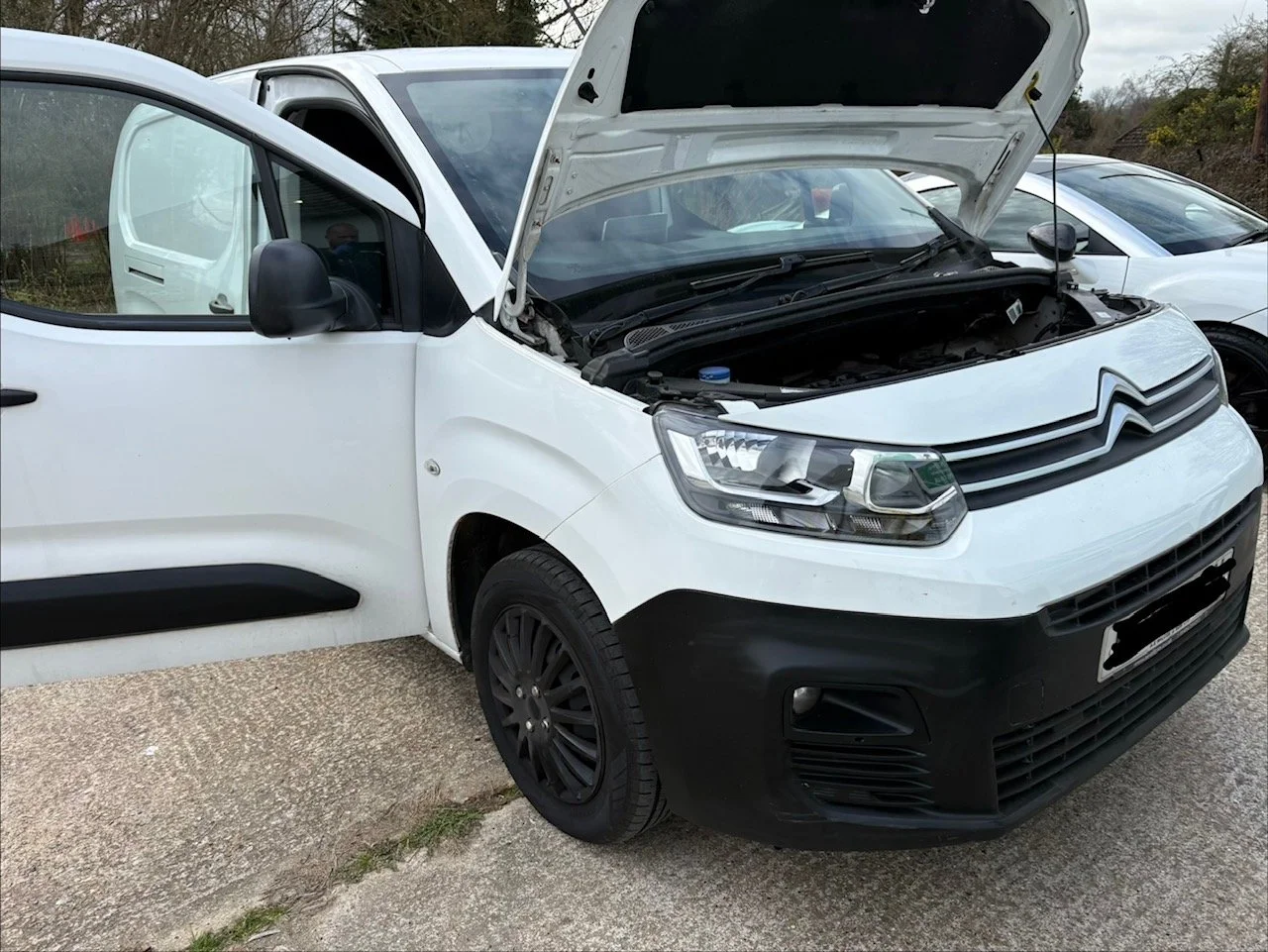 White Citroën commercial van undergoing fuel economy tuning and ECU diagnostics at Sittingbourne Industrial Park to reduce fleet running costs.