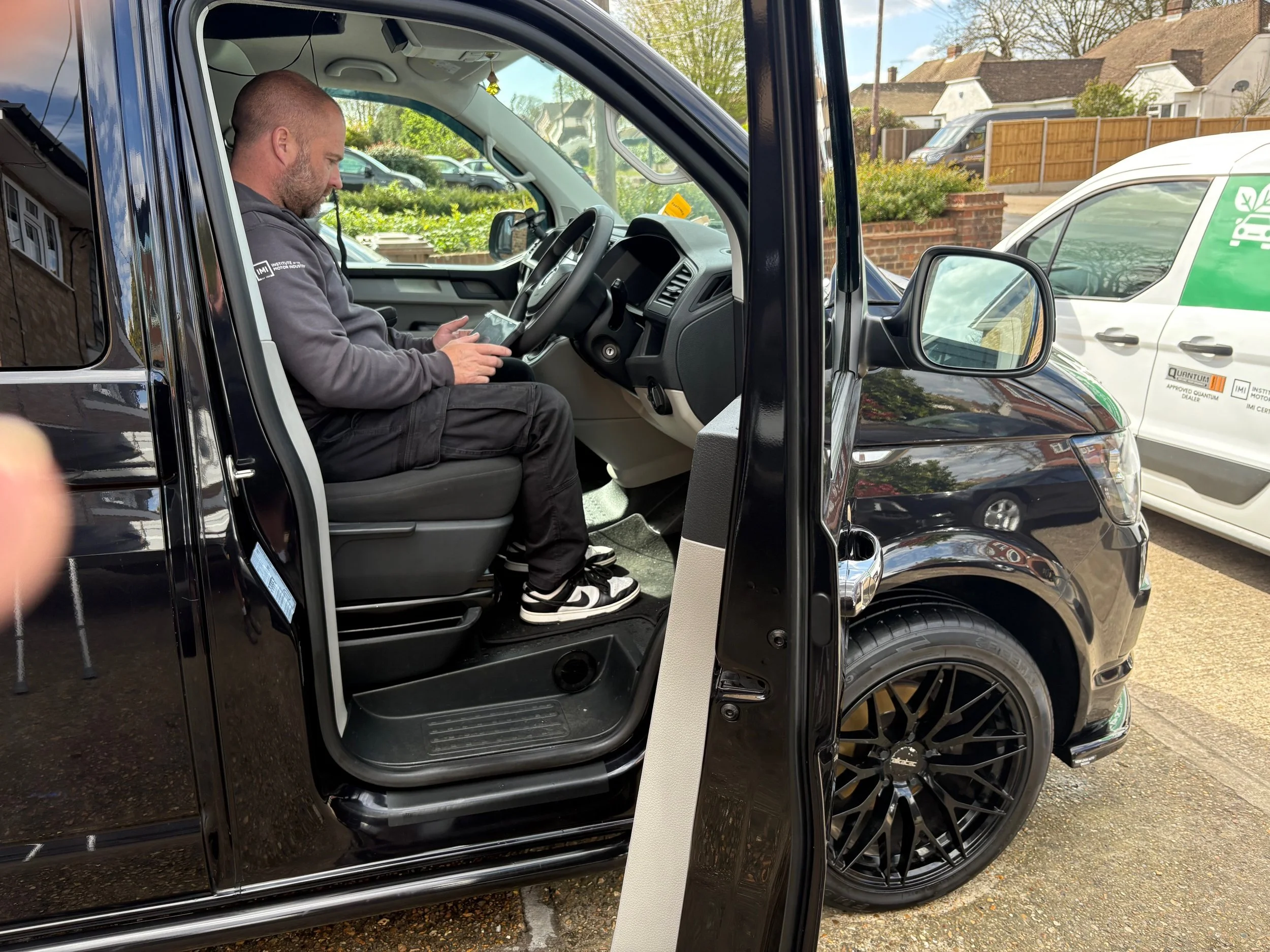 A professional technician performing ECU diagnostics and tuning inside a customer’s vehicle using specialized high-end equipment in Rainham.