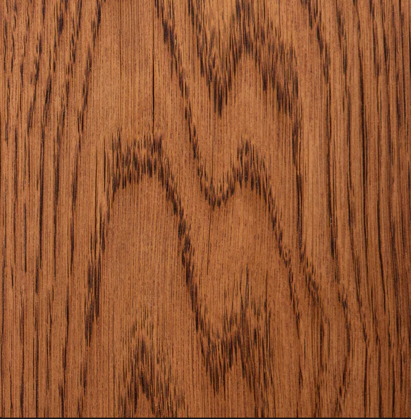 Close-up of a wood surface with a natural grain pattern.