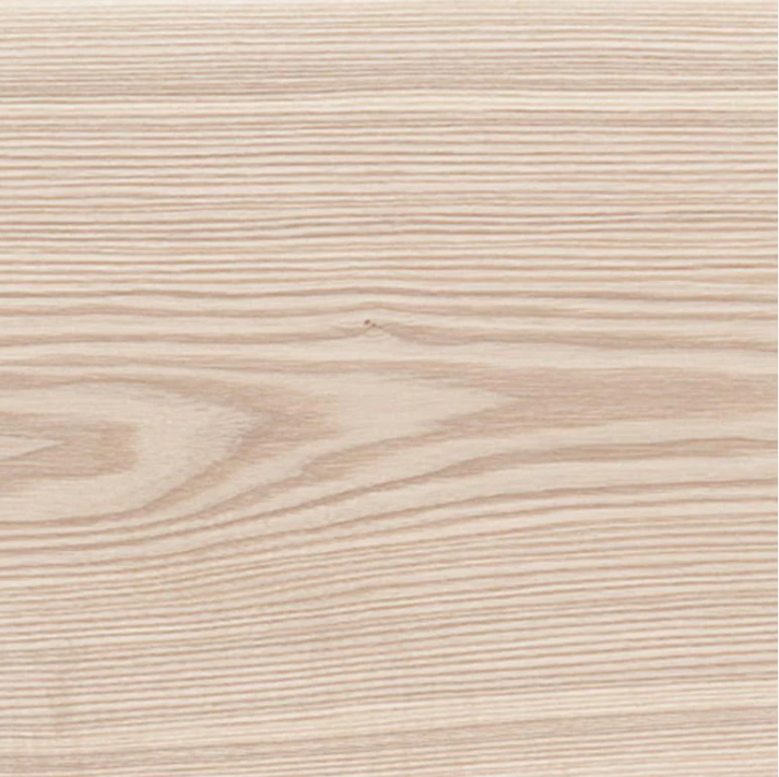 Close-up image of light-colored wooden surface with visible grain patterns.