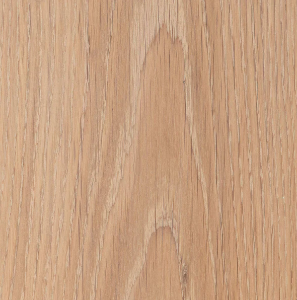 Close-up of a wooden surface with a natural light brown color and visible wood grain patterns.