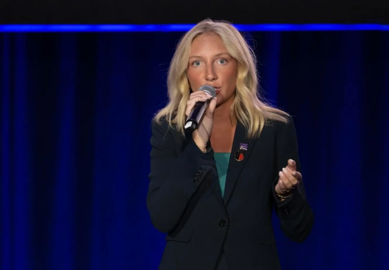 On the stage at the International Junior Auctioneer Championship — stepping up to the mic for the first time on an international level. Nerves, excitement, and years of passion all coming together in one moment, representing the next generation of au