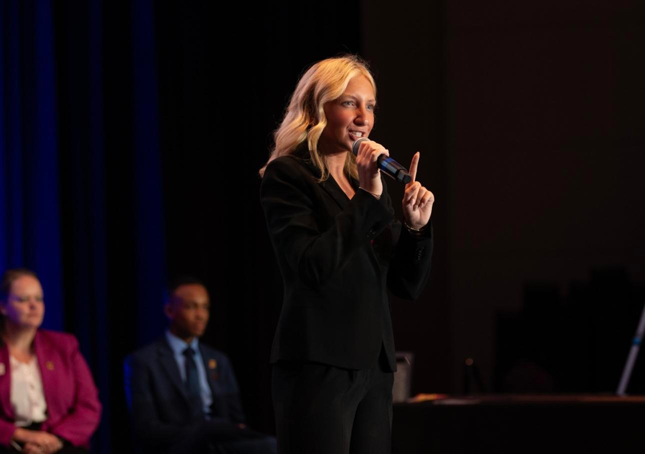 Answering my interview question on stage at the International Junior Auctioneer Championship — speaking with purpose, confidence, and passion for the industry. A moment to share my story, stand behind my why, and represent the next generation of auct