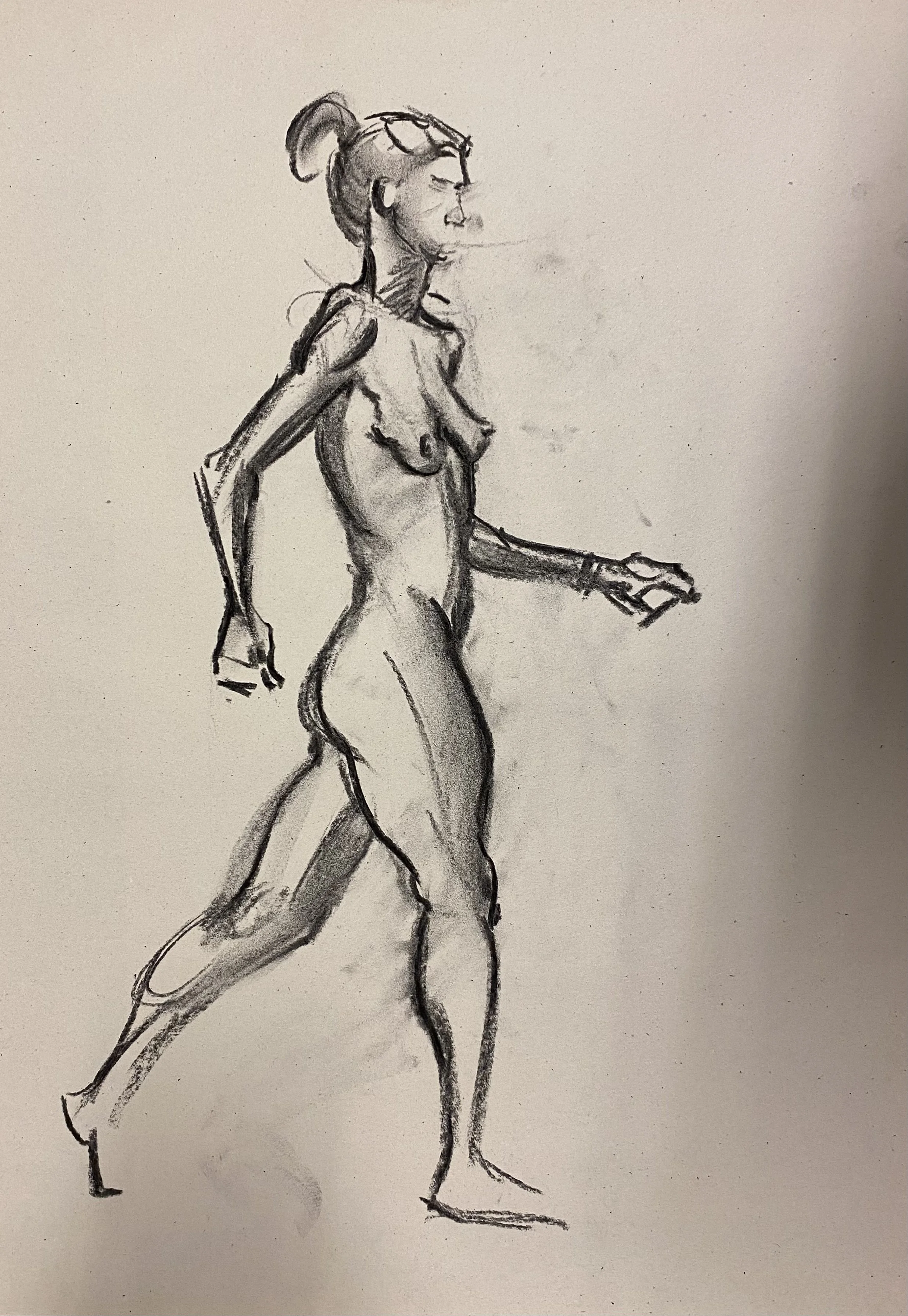 A black and white sketch of a nude woman walking, with her hair tied in a bun.