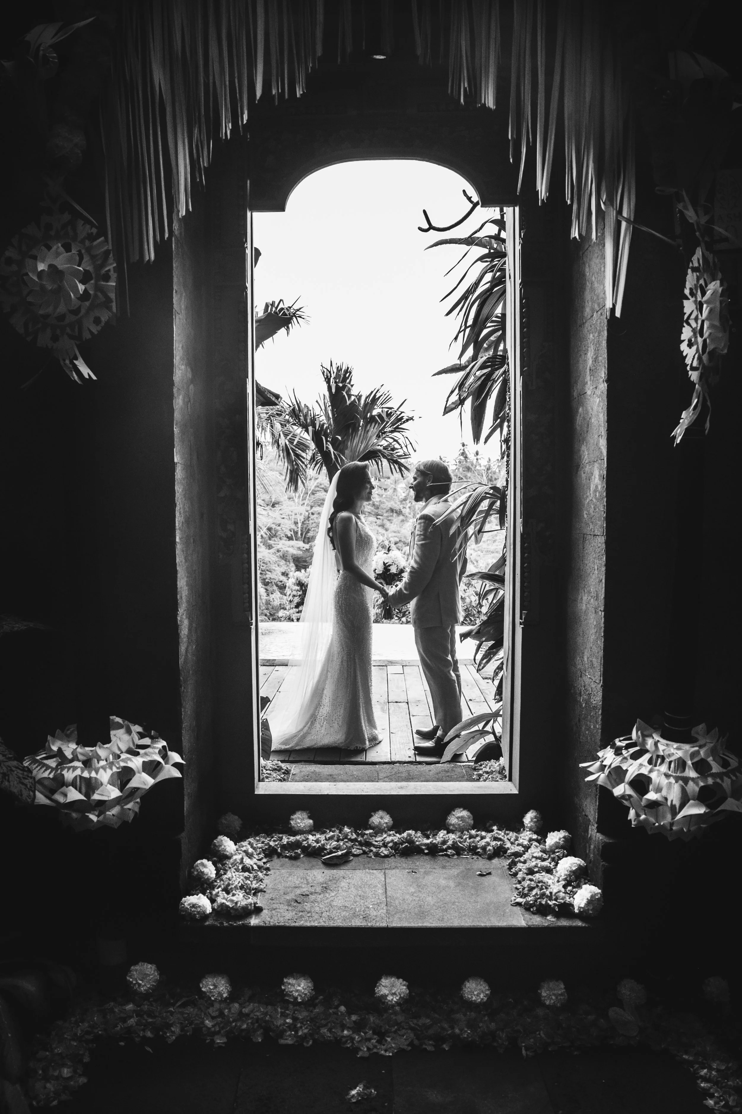 Bali villa wedding details — floral arch and tropical centerpiece styling at a luxury Ubud jungle venue.