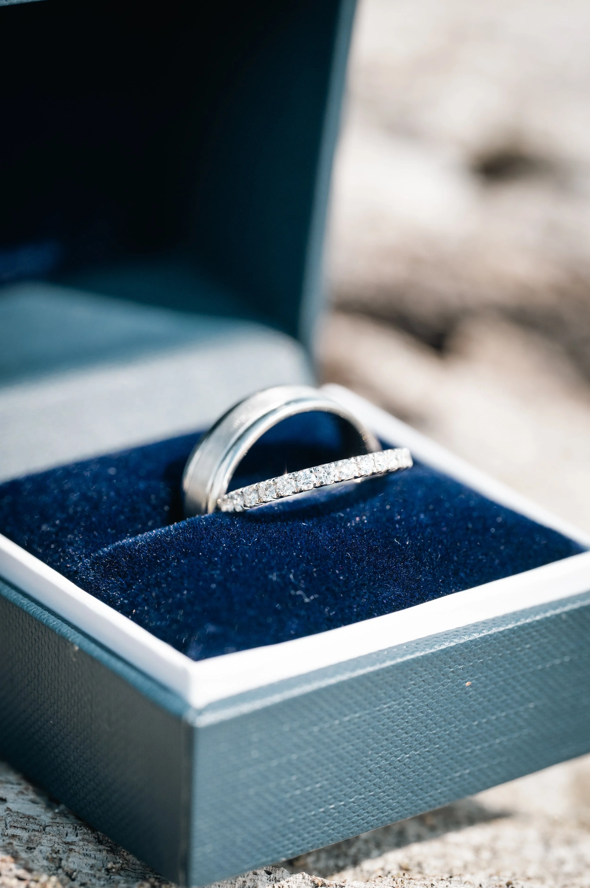 Destination wedding at a luxury villa in Puerto Escondido, photographed with a natural, emotion-driven approach for a couple from the United States. Photography of the rings in sand.