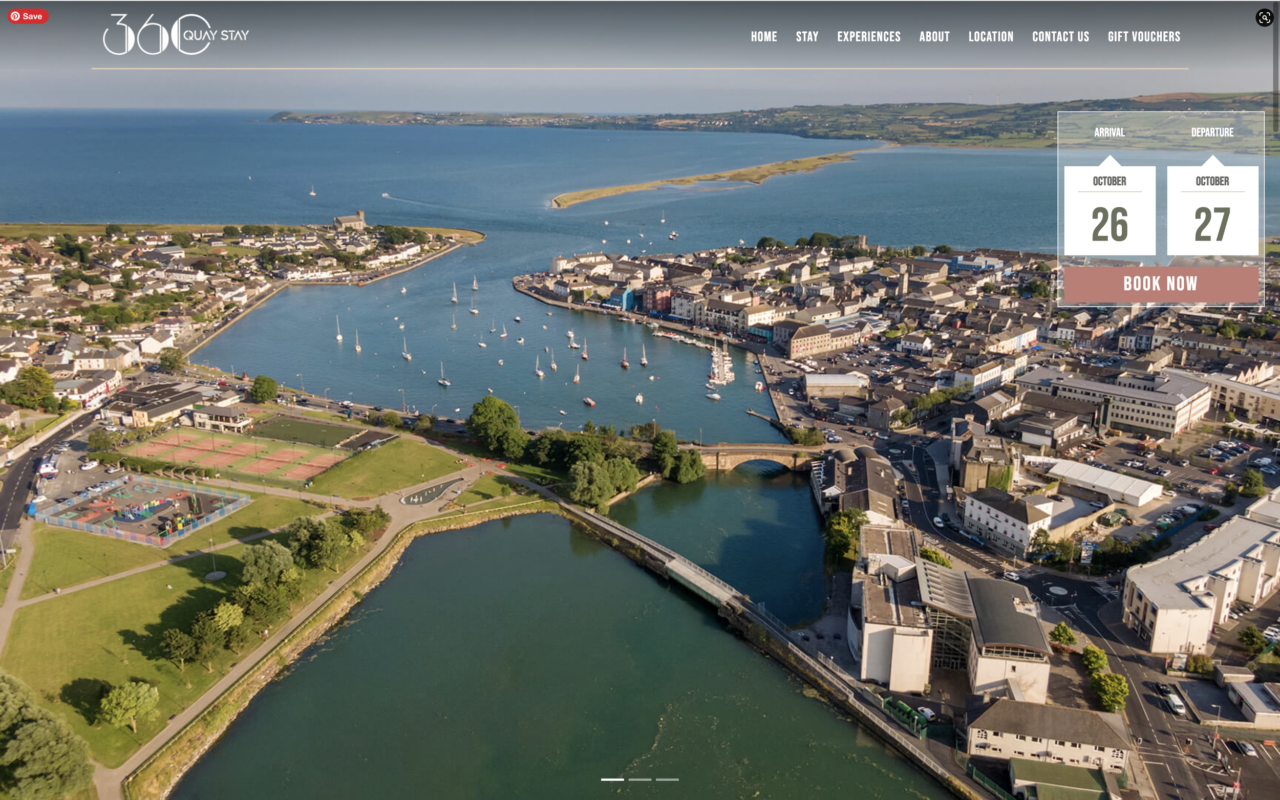 A bird’s eye view of the blue waters of Davitt's Quay with ships sailing on it on a summer’s day.