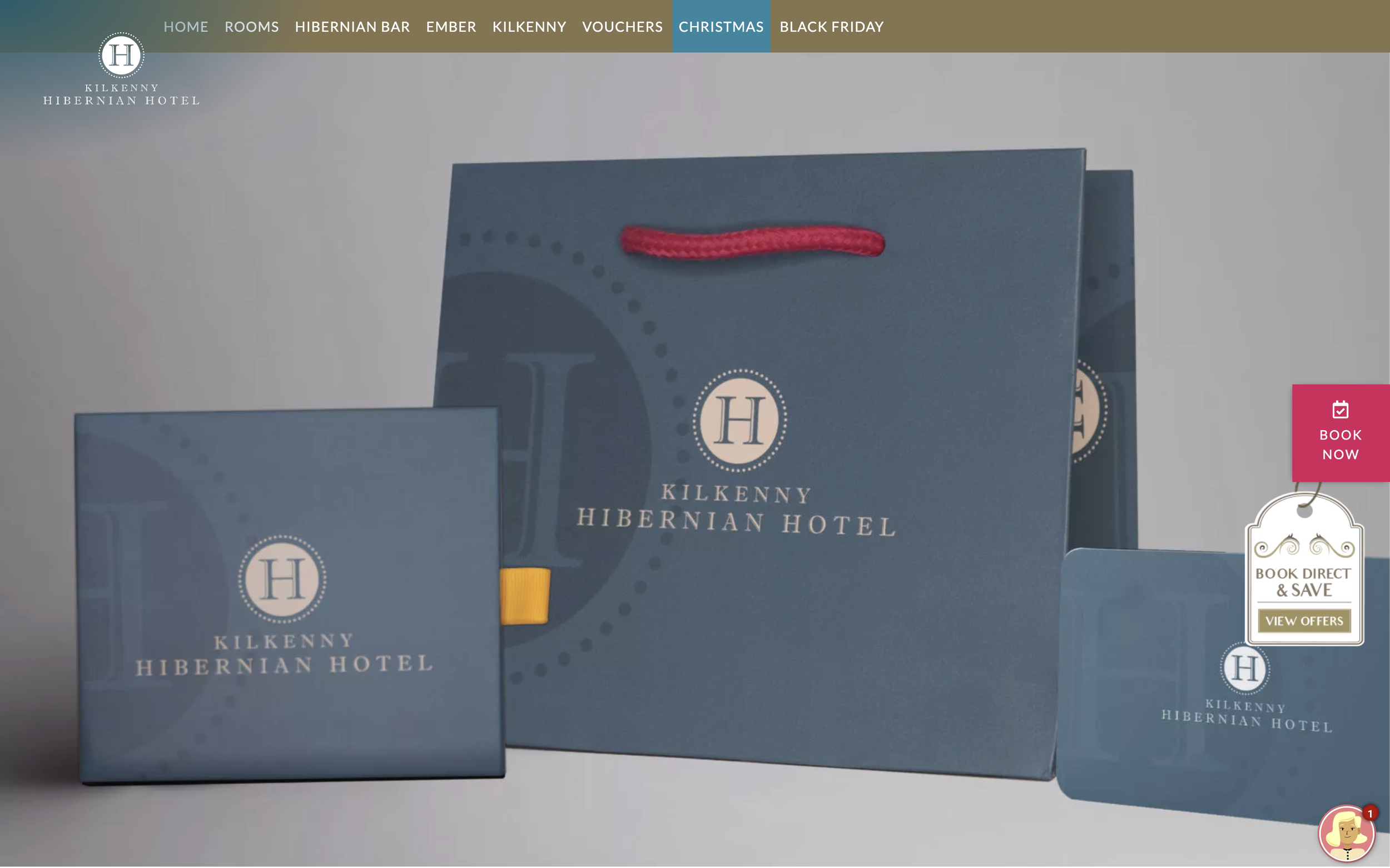 A large blue bag with the hotel’s logo on it, alongside a smaller blue box used for vouchers.