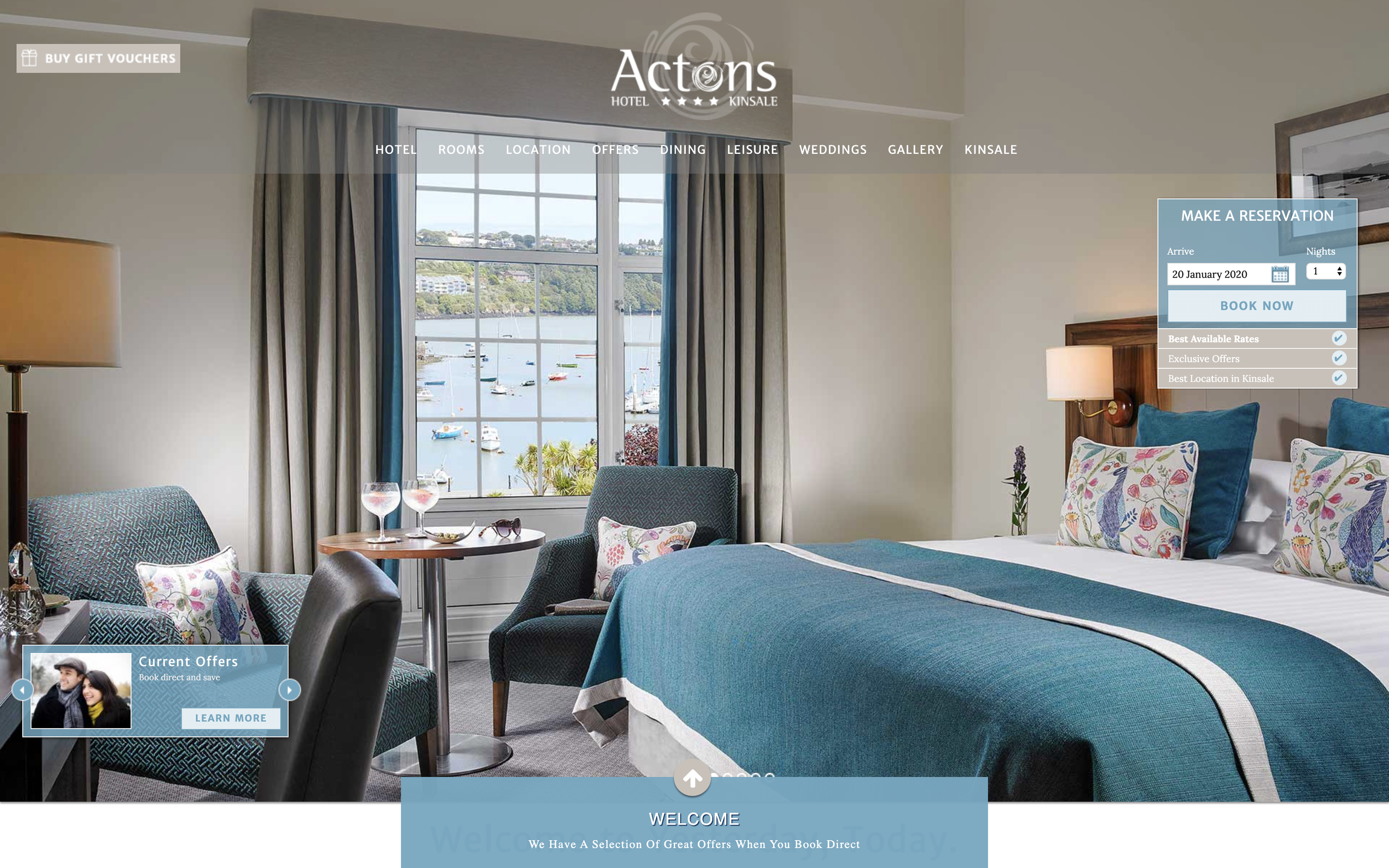 A beautiful suite filled with sky blue furniture overlooking Kinsale Harbour on a clear summer’s day