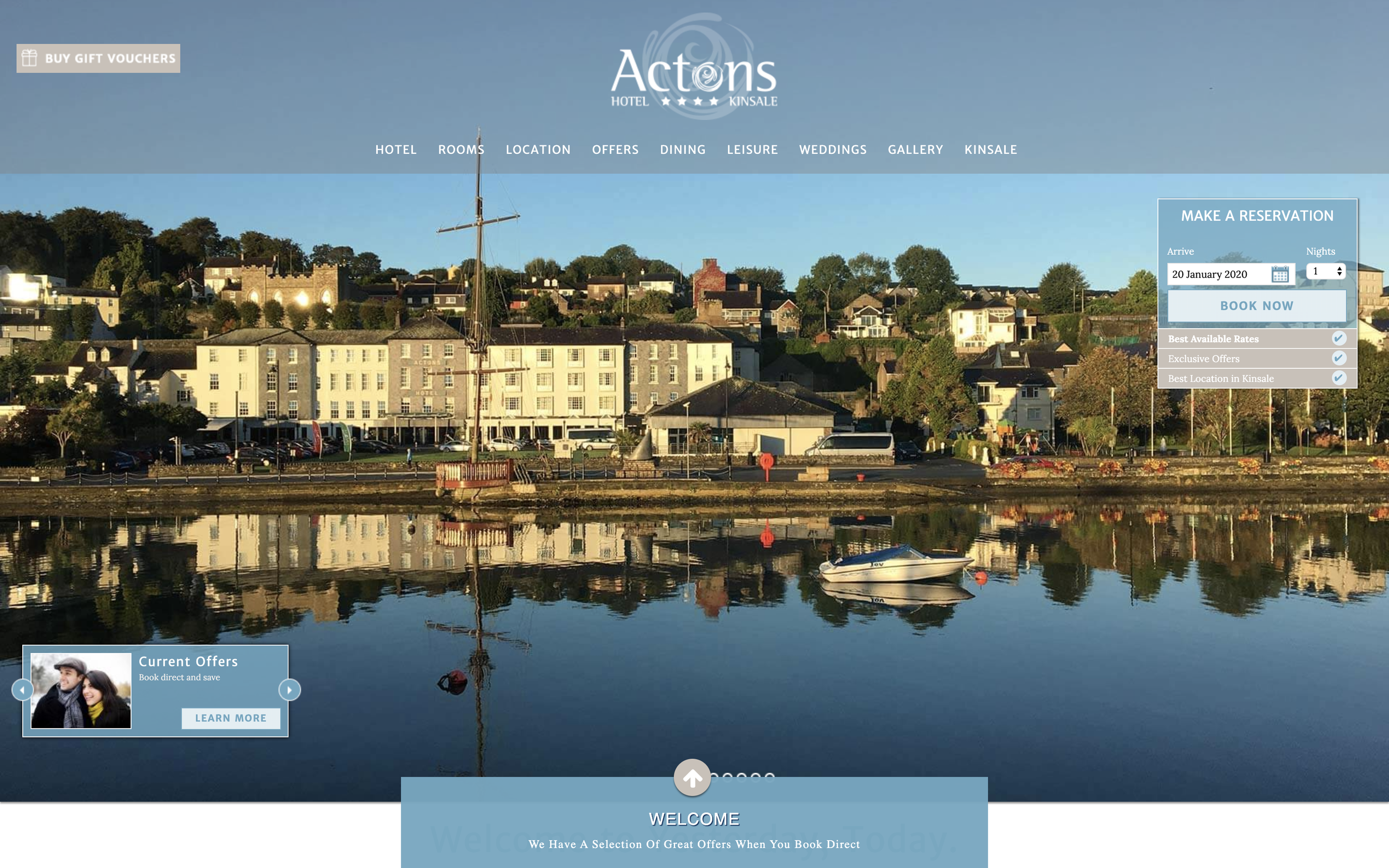 A stunningly beautiful shot of the outside of the hotel, perched on the harbour, from the water.
