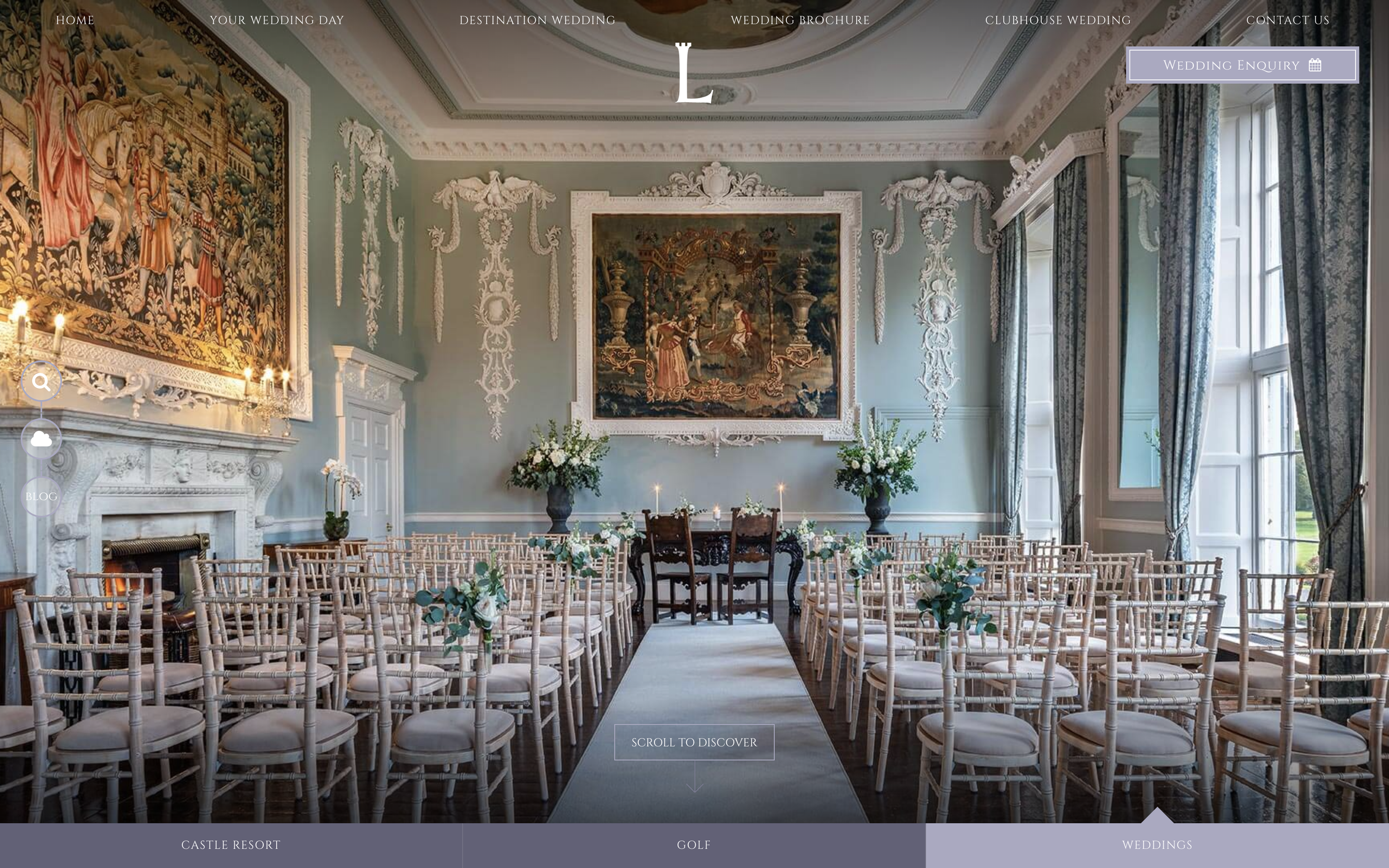 A beautifully ornate ballroom with paintings on the wall and vintage chairs laid out for a wedding.