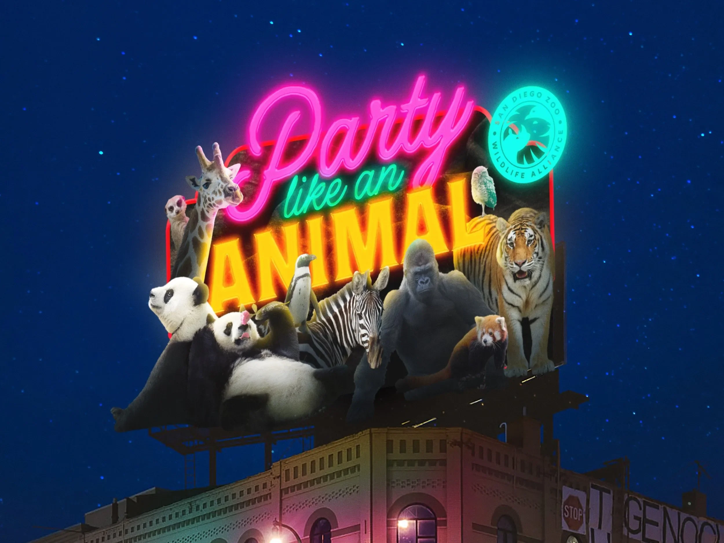 Nighttime illuminated billboard featuring neon signs and cartoon animals including a giraffe, panda bears, a zebra, a gorilla, a tiger, a raccoon, and a fox, with the text 'Party like an ANIMAL' and a circular logo for San Diego Zoo Wildlife Alliance
