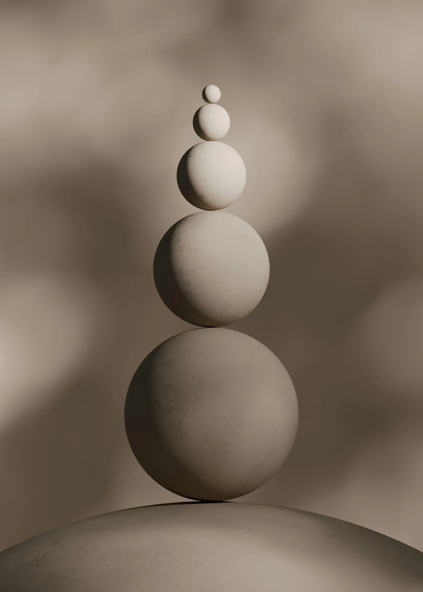 Five white spherical stones stacked in decreasing size, with a blurred neutral background.