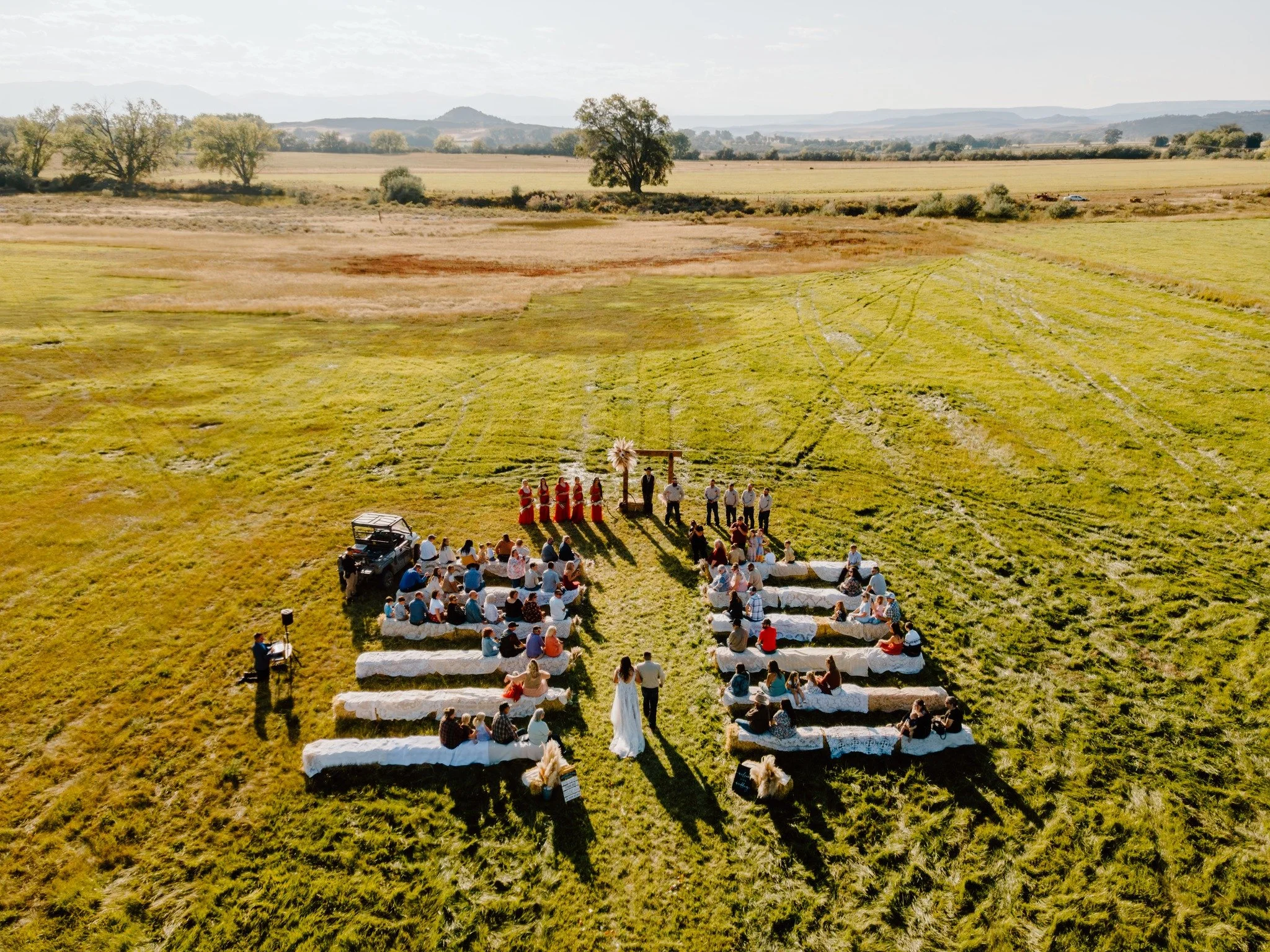 Walking down the aisle is one of the most important moments of the wedding day. It seems like time slows down, but all the moments happen so quickly. 

We love to get various perspectives from the ceremony! Aerial perspective is one we absolutely lov