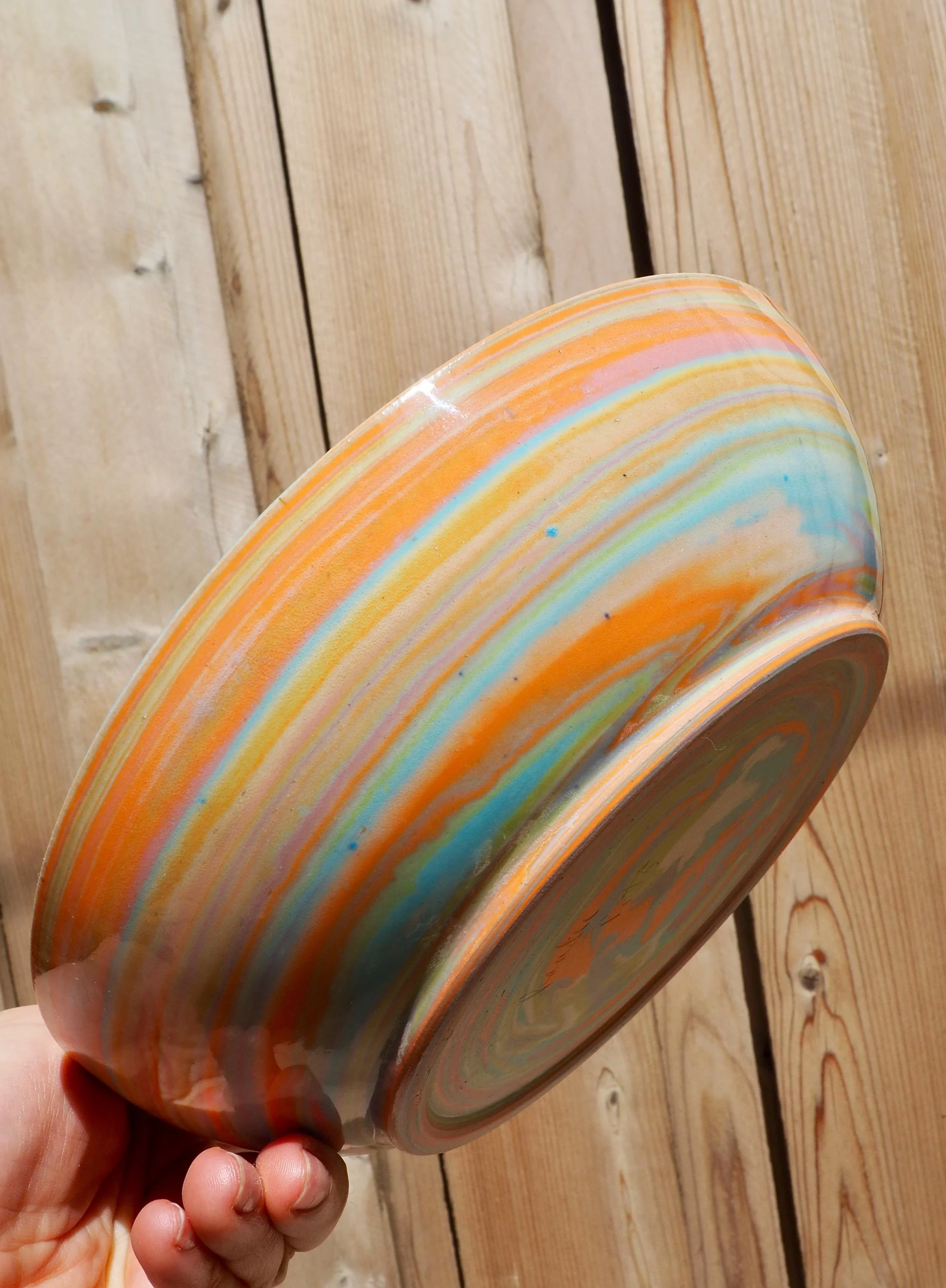 Swirl Bowls, a stacked set of four marbled bowls in pastel pink, blue, green and orange