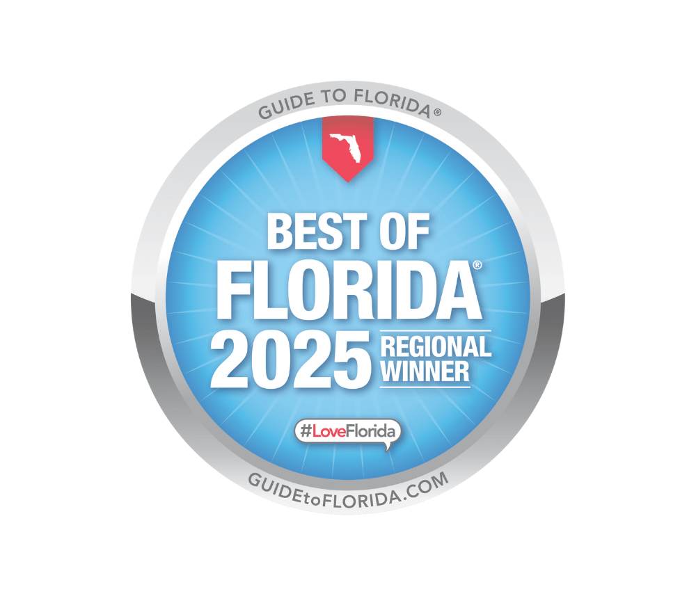 A round badge with a blue background featuring white text that reads "Best of Florida 2025 Regional Winner". The top of the badge has a red map outline of Florida, and the outer ring has the text "Guide to Florida" at the top and "GUIDEtoFLORIDA.COM" at the bottom. There is a hashtag #LoveFlorida in a speech bubble below the main text.