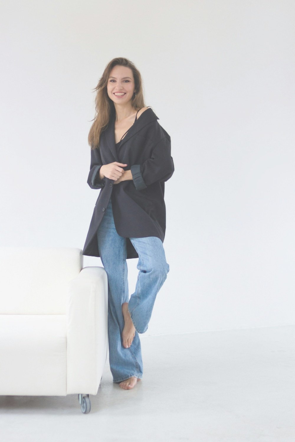 A woman who struggles with perimenopause symptoms smiles as she finishes her counseling session with therapist Gail Gerbig at Seaside Mental Wellness in Lakewood Ranch, FL.