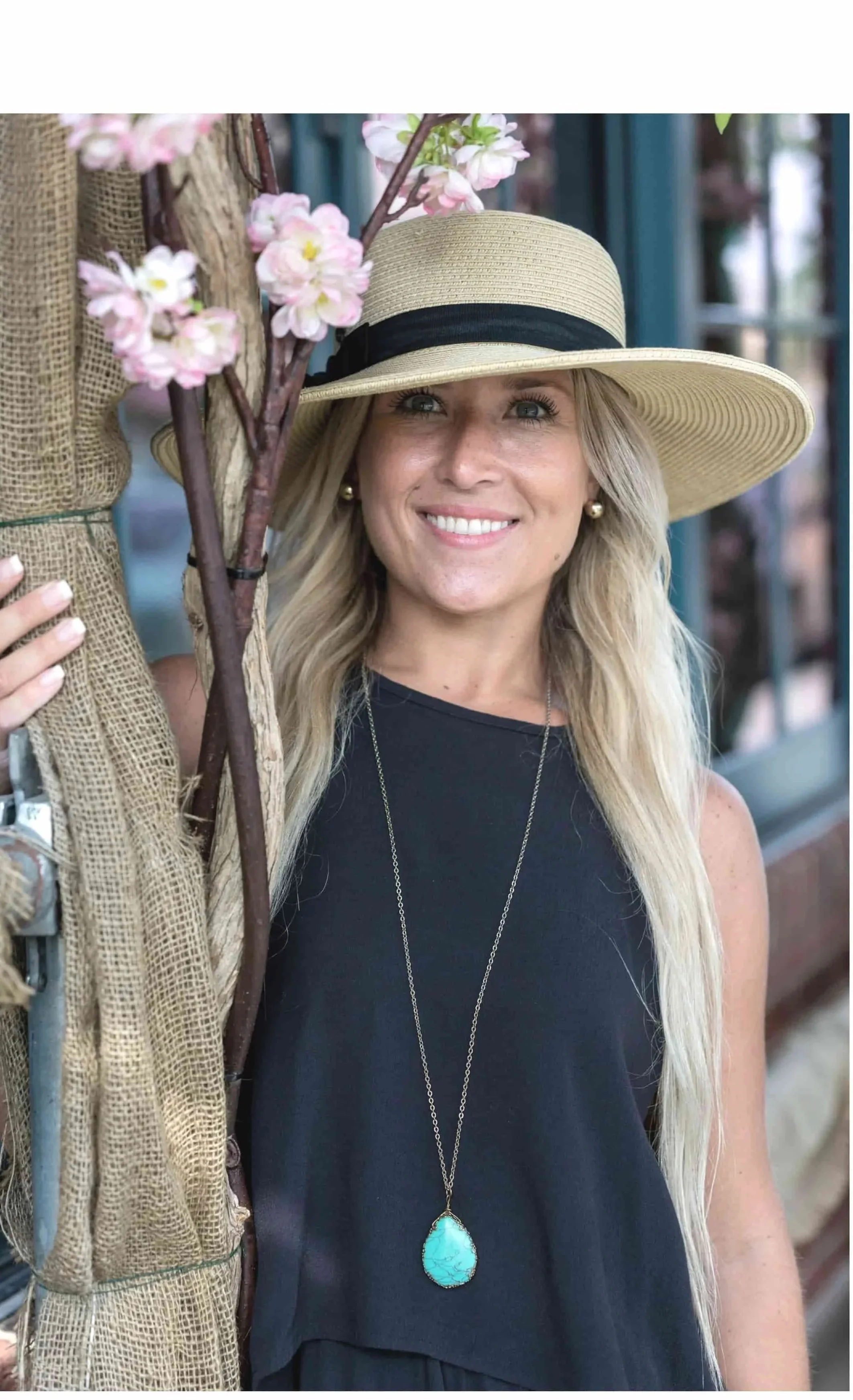 A woman smiles as she reflects on her counseling session with therapist Gail Gerbig, LMHC at Seaside Mental Wellness in Lakewood Ranch, Florida.