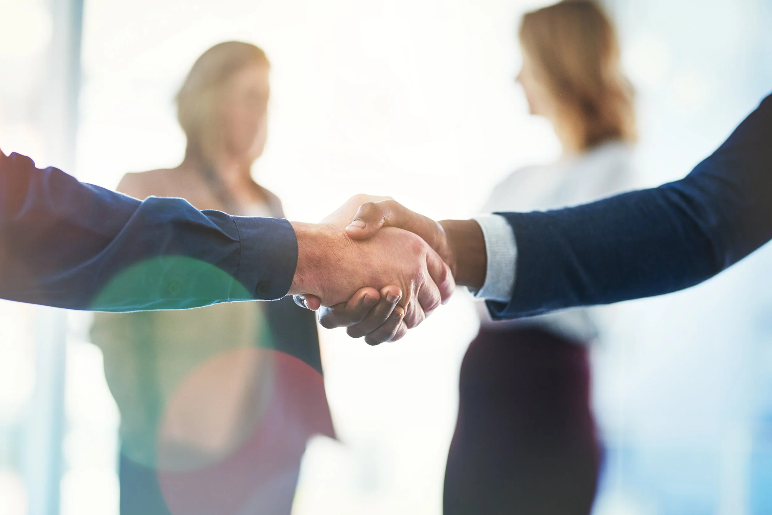 cropped-image-business-people-shaking-hands.jpg