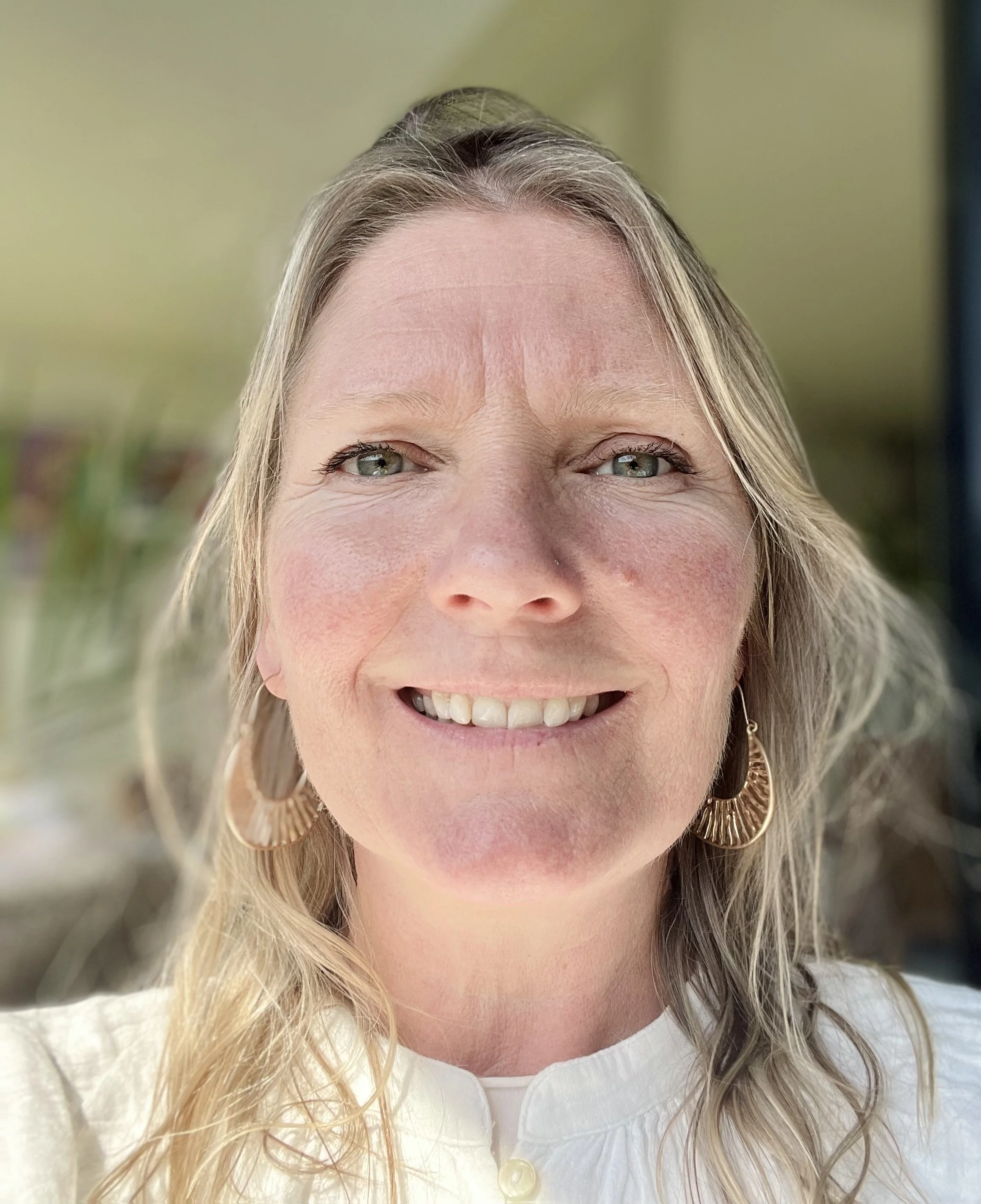 portrait of warmly smiling therapist.