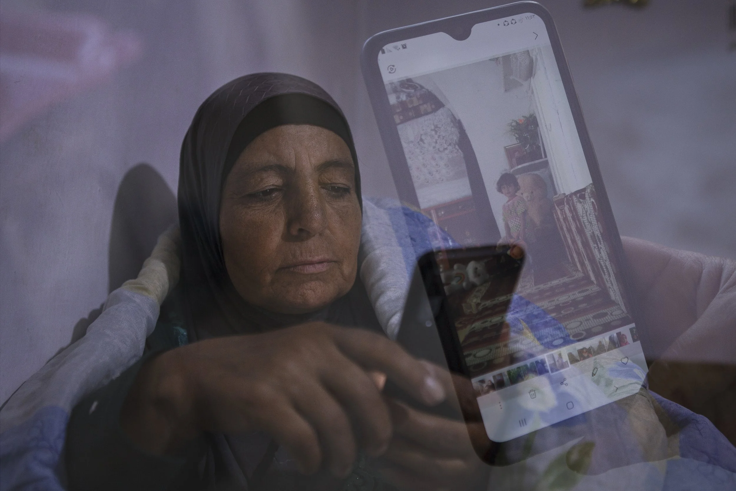 Fatma scrolls through the news on her phone — a nightly ritual since the fall of Assad, in search of signs of change and hope. This photo was taken in December 2024, after Assad’s fall reignited the possibility of return for millions of Syrians aroun