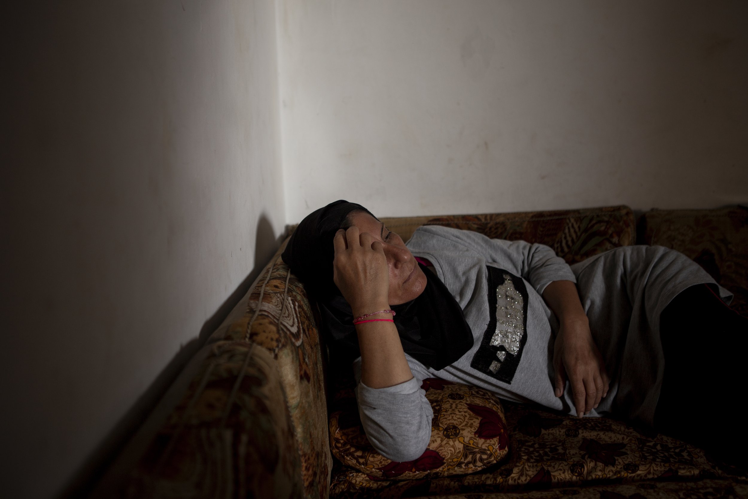 Warde rests at home after an early morning spent working in the greenhouse and preparing breakfast for the entire family. During the hottest hours of the day, she takes time to recover before returning in the evening to work alongside her sisters. It