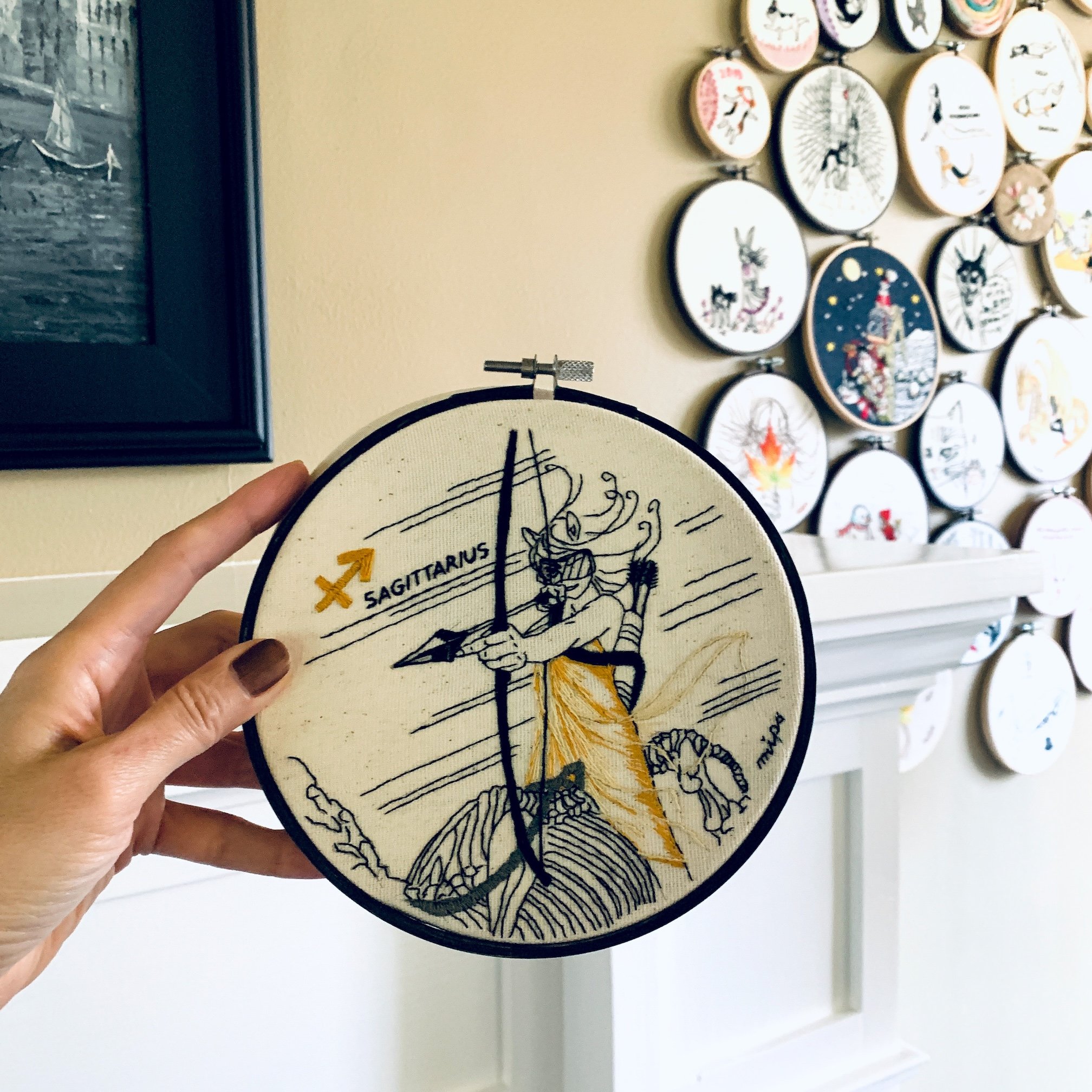 display of dark zodiac embroidery art hoop.jpeg