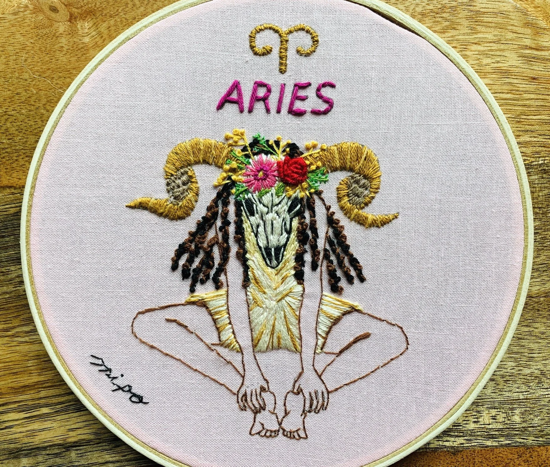 Aries embroidery hoop art with ram horns and flowers.jpg