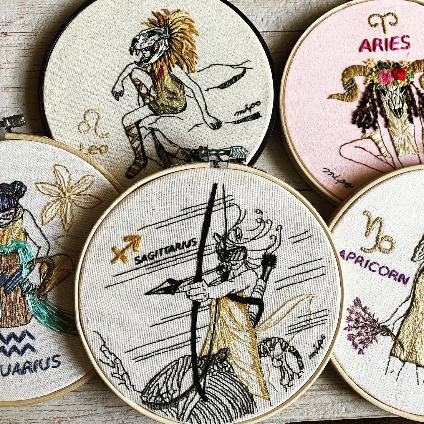 embroidery hoop art wall of zodiac series.jpeg