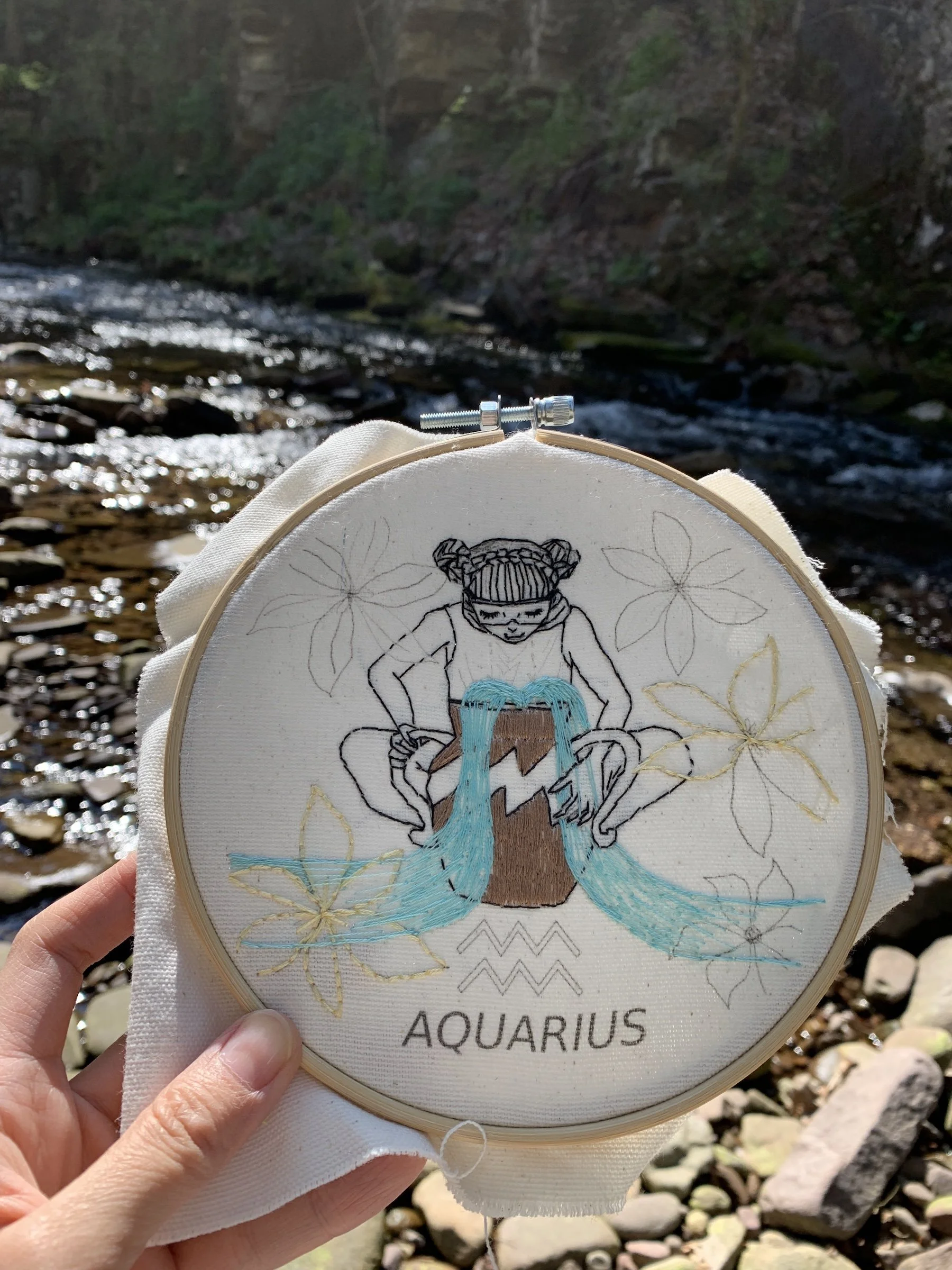 Stitching the water bearer-Aquarius at a river.jpg