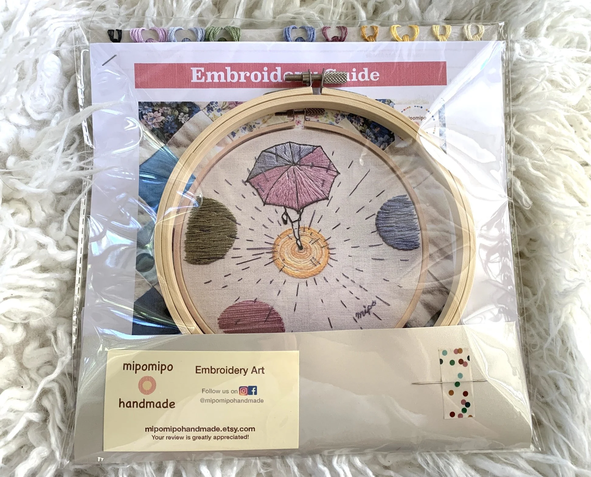 Beginner embroidery kit featuring umbrella and rain puddle design.jpeg