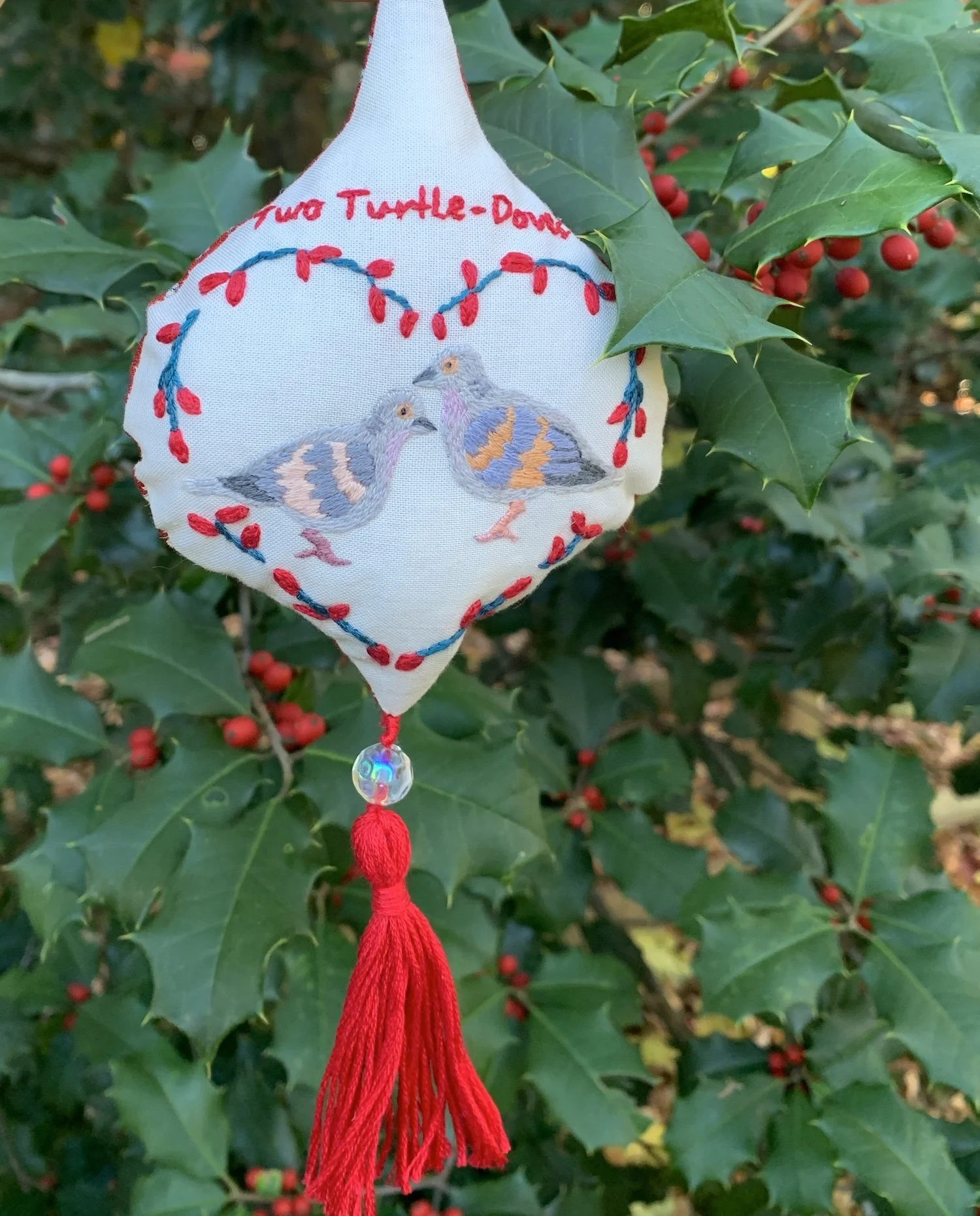 Two turtle dove embroidery ornament against holly tree.jpg