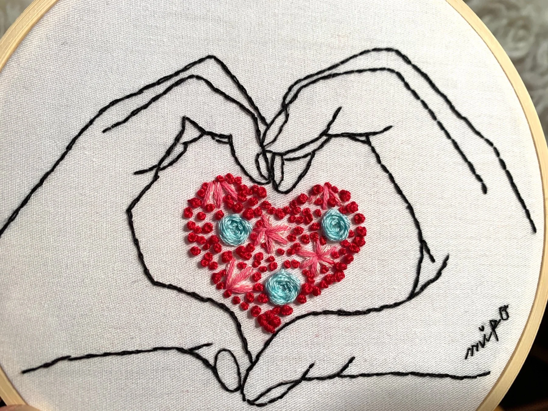 Close up to center heart embroidery.jpeg