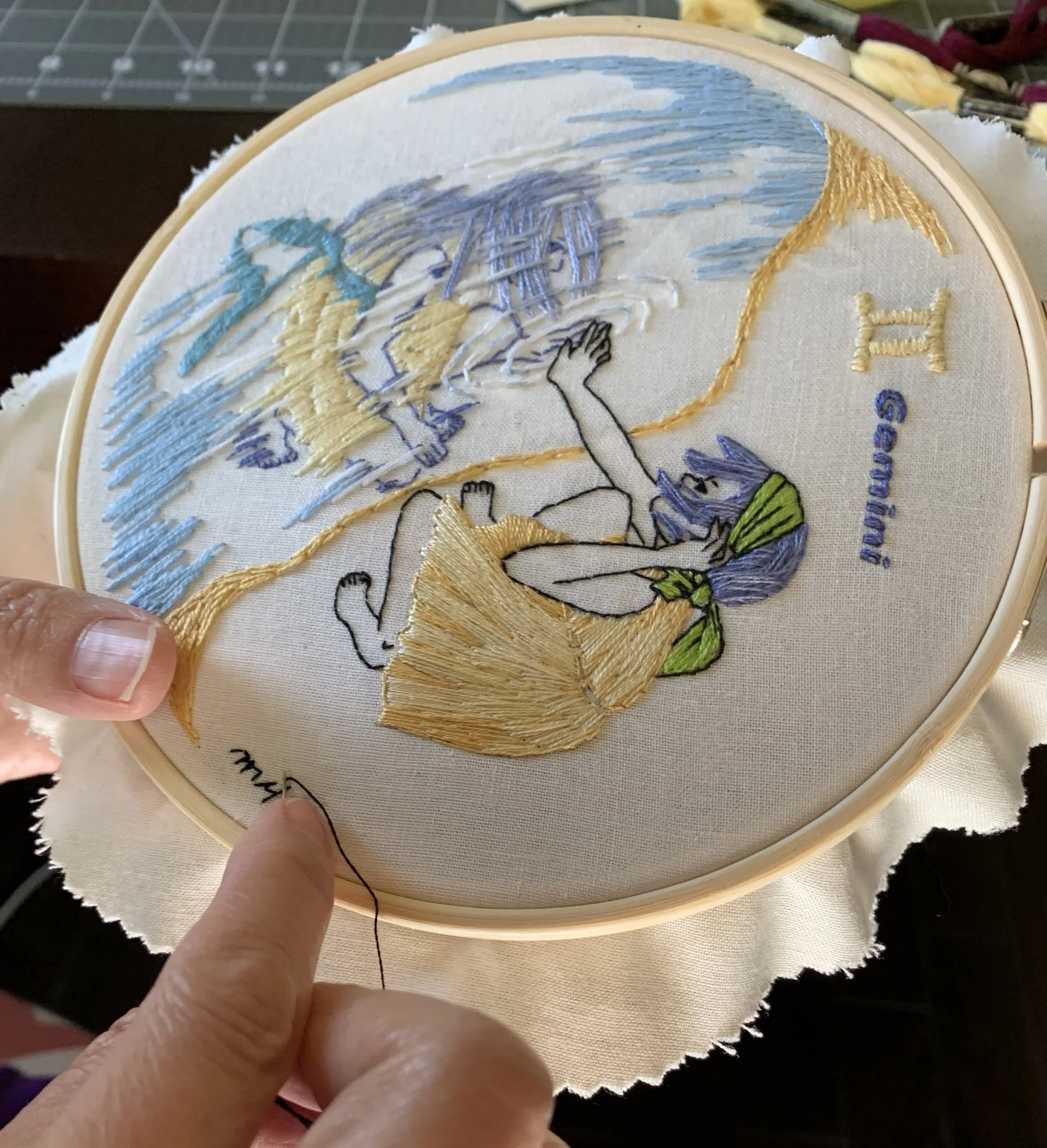 finishing up Pre-printed fabric Gemini embroidery kit with detailed stitching.jpeg