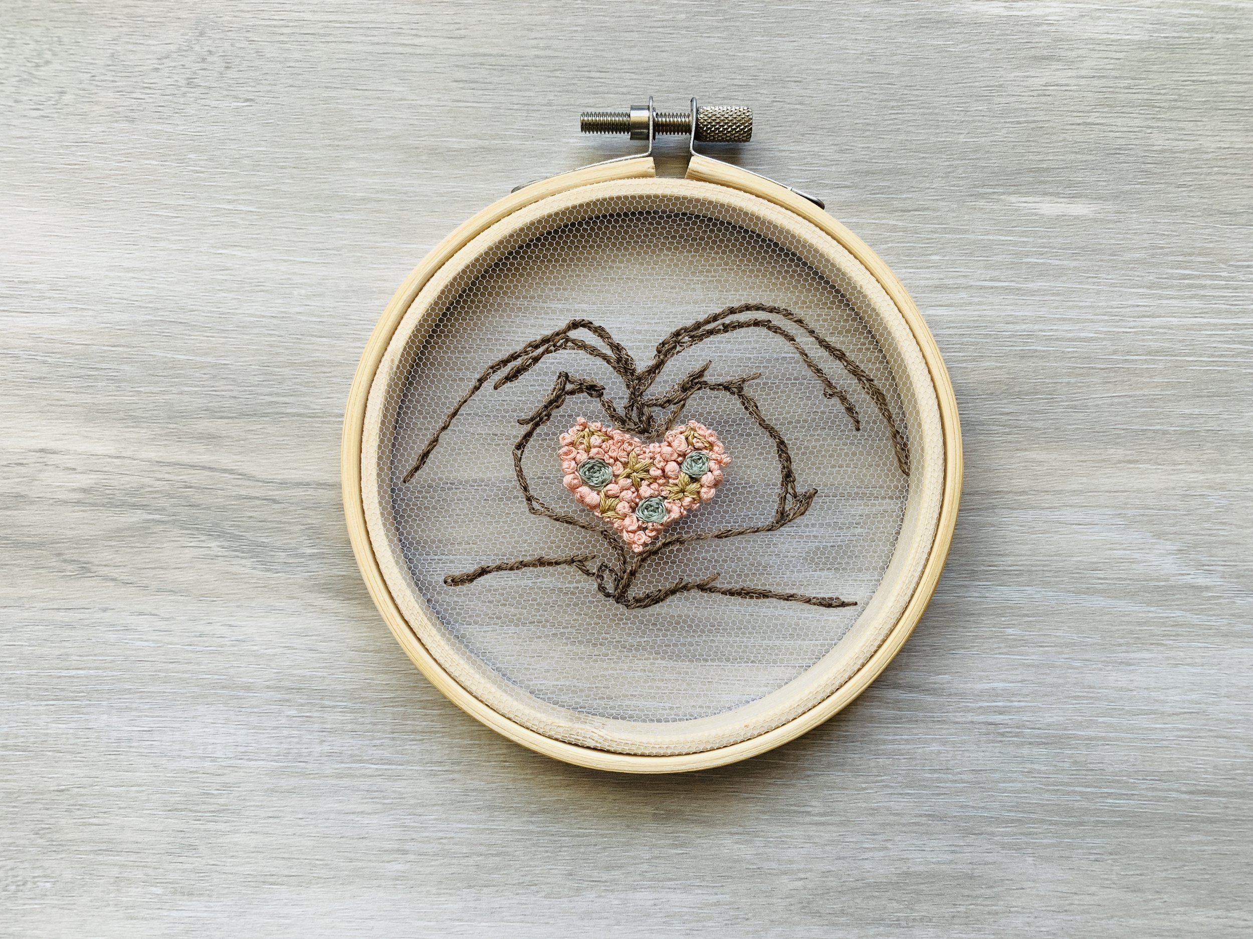 Heart embroidery applied on a sheer tulle fabric