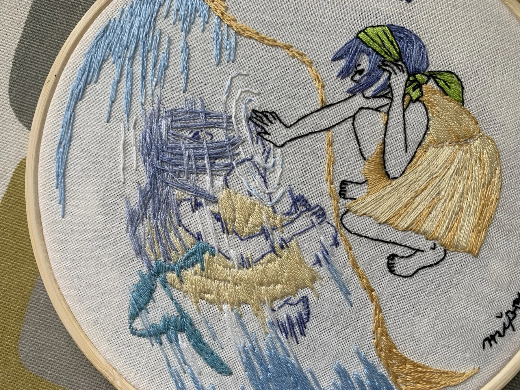 Hand embroidery hoop art showing Gemini girl and water reflection.jpeg