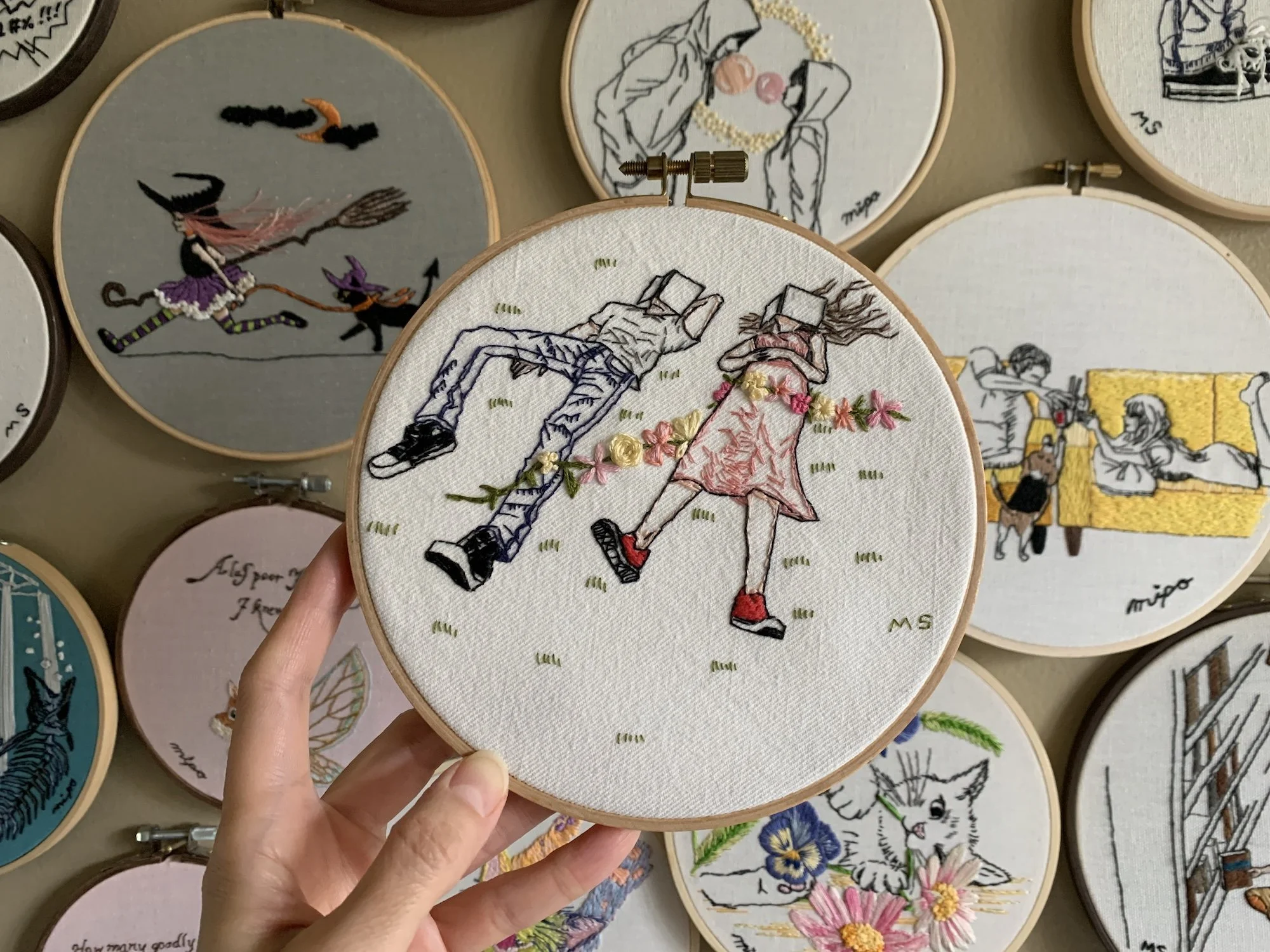 Napping together embroidery hoop art fron of hoop garalley wall.jpeg