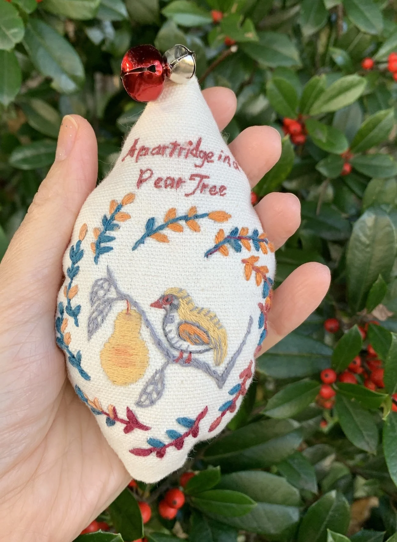 close up of a partridge in a Pear tree embroidery ornament