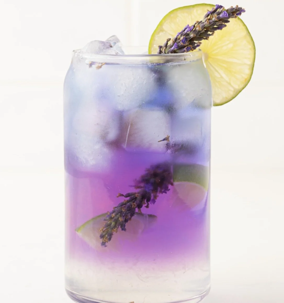 Purple butterfly tea cocktail with lavendar and lemon fresh garnish