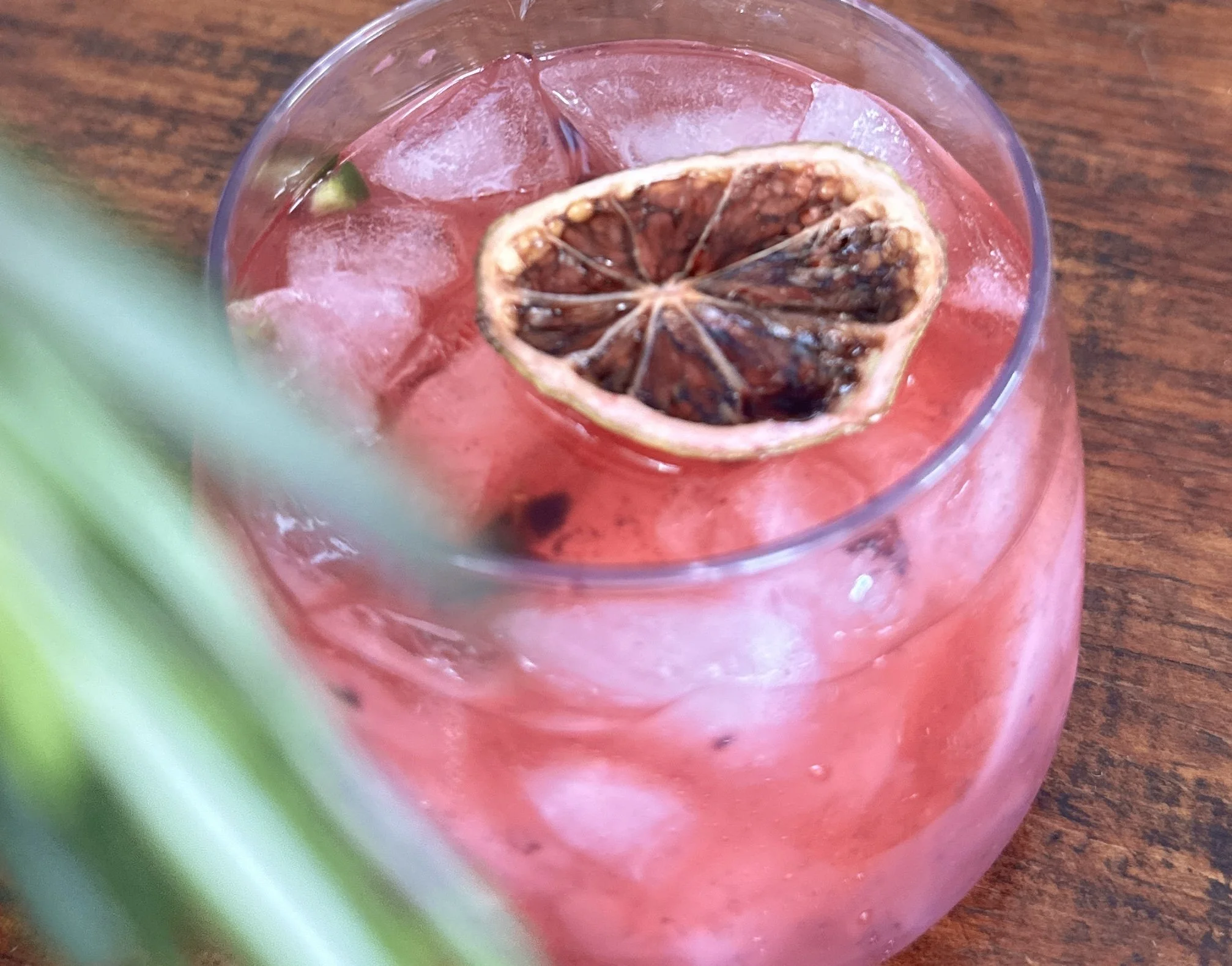 Garden to glass berry margarita with dehydrated lime garnish