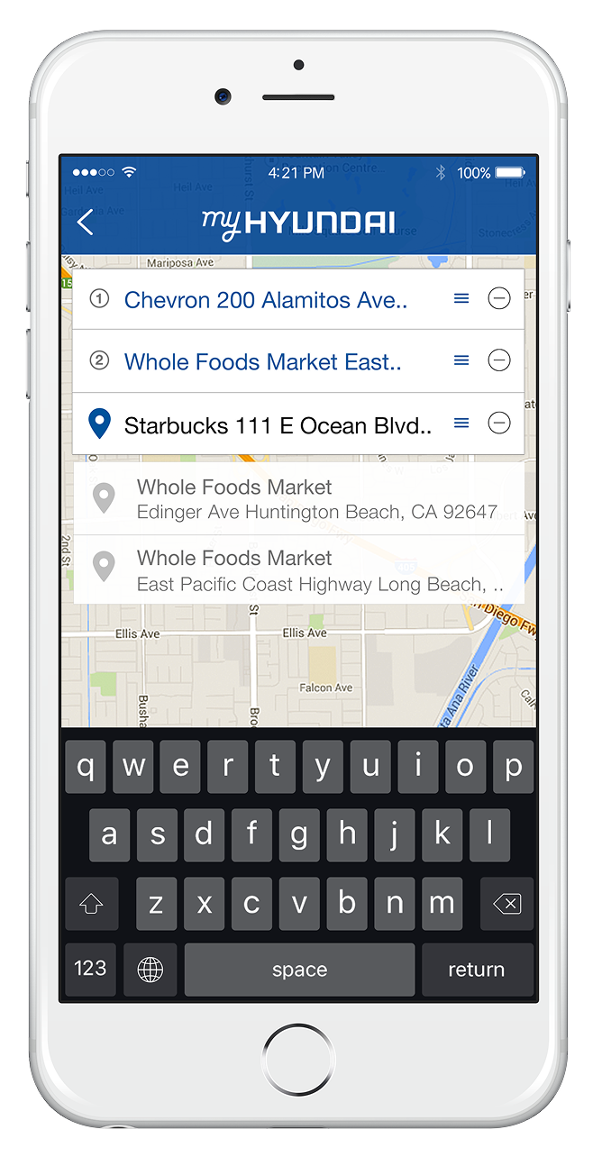 Smartphone screen showing a map with a list of nearby locations, including Chevron gas station, Whole Foods Market, and Starbucks, with a virtual keyboard visible at the bottom.
