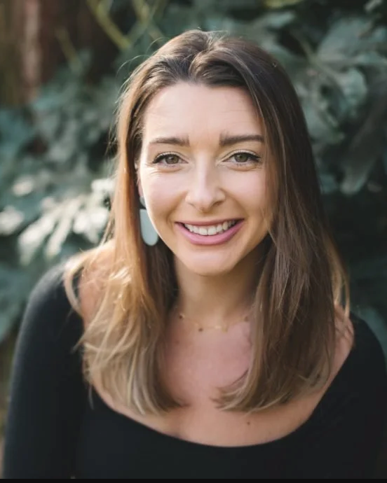 Woman with brown hair and black shirt
