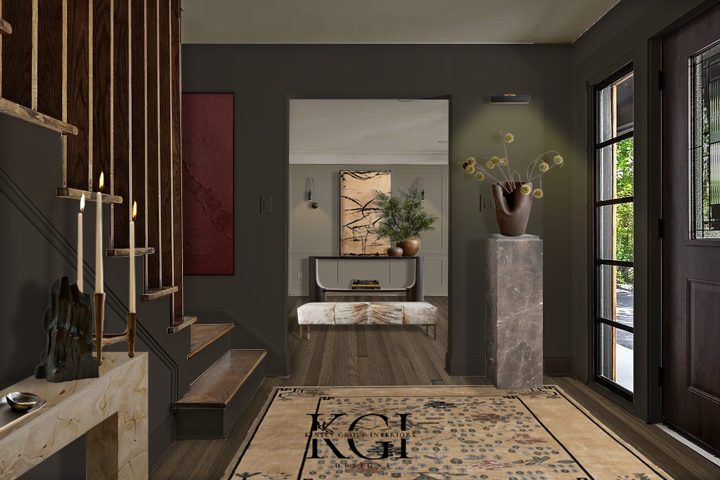 Modern entryway featuring a staircase with wooden steps, a marble fireplace with candlesticks, a decorative rug with floral patterns, a wooden door with glass panels, a dark accent wall, and a tall marble pedestal with a vase of yellow flowers.