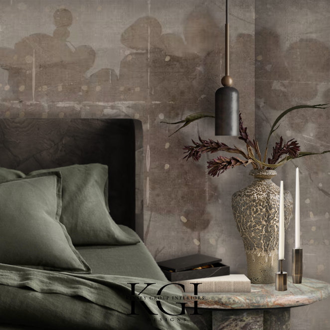 Interior bedroom scene featuring a bed with green bedding, an ornate vase with dark red leaves on a marble bedside table, and a hanging pendant light.