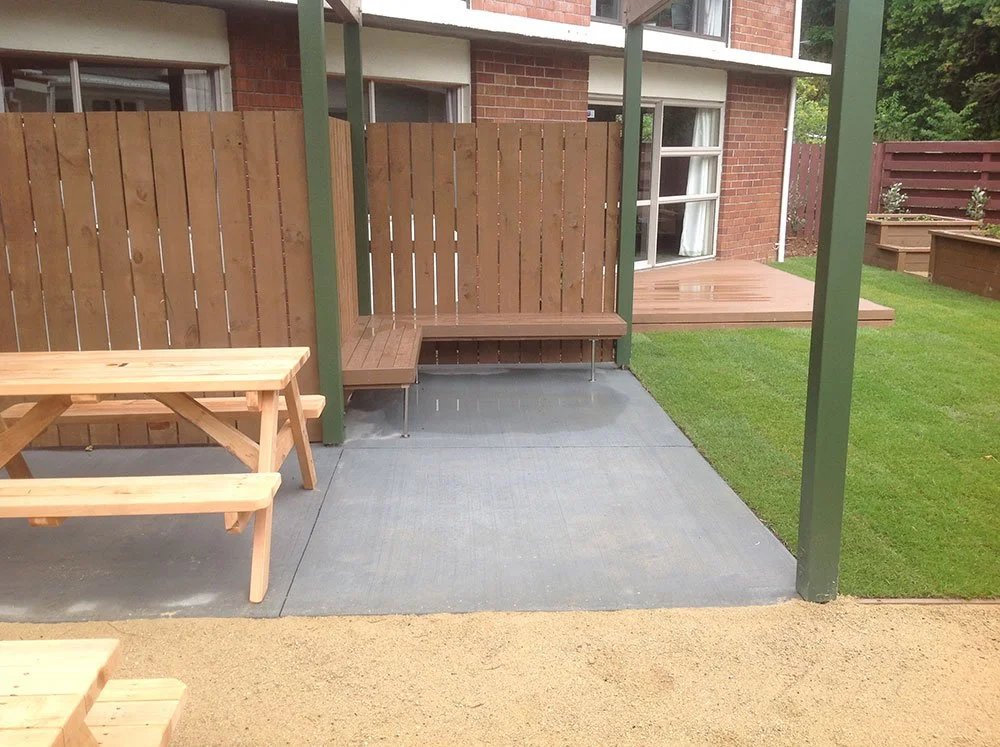 6-Vic-Uni-Halls-Outdoor-Area---Timber-fencing-and-seating,-pergolas,-timber-deck,-timber-planters,-ready-lawn,-coloured-concrete-and-limestone.jpg