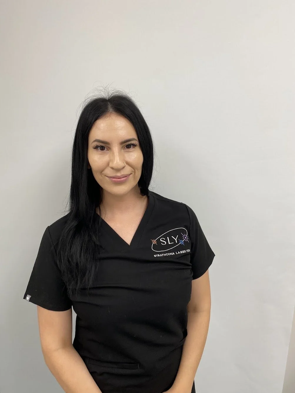 Pink and yellow athletic running shoes with white soles on a white background.