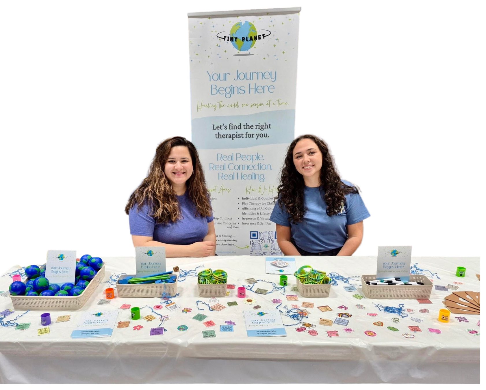 Tiny Planet Counseling team sharing mental health resources at a community event