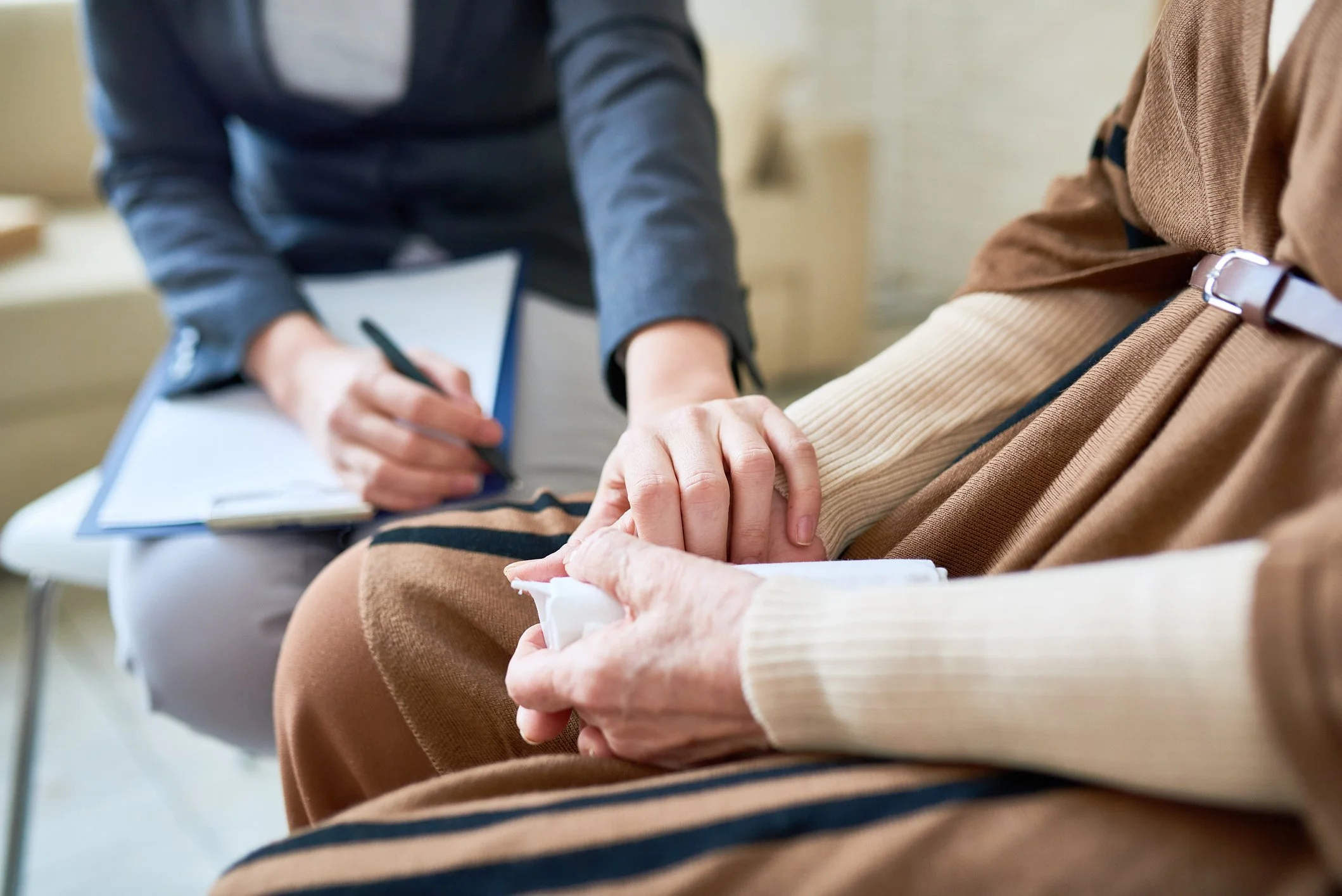 A healthcare professional taking a patient's blood pressure during a medical checkup.