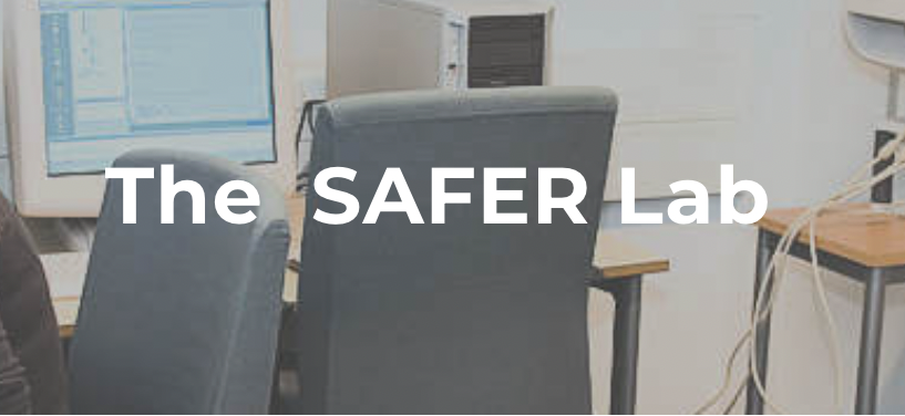 A computer lab with chairs, computers, and a monitor with the text 'The SAFER Lab' overlaid.